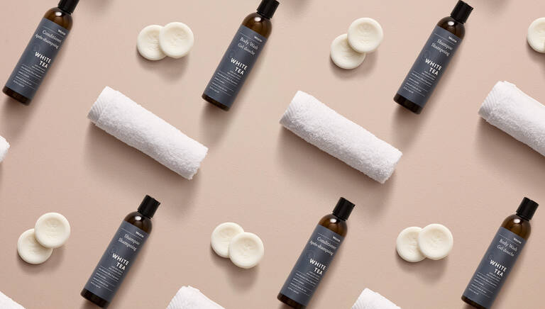 Alternating pattern of Marriott Bonvoy Boutiques bath products (shower gel, soap bars, and rolled hand towel) Alternating pattern of Marriott Bonvoy Boutiques bath products (shower gel, soap bars, and rolled hand towel)