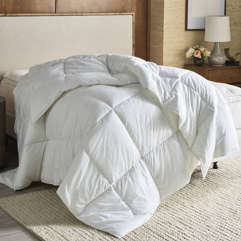 Westin Hotels down alternative duvet draped on mattress