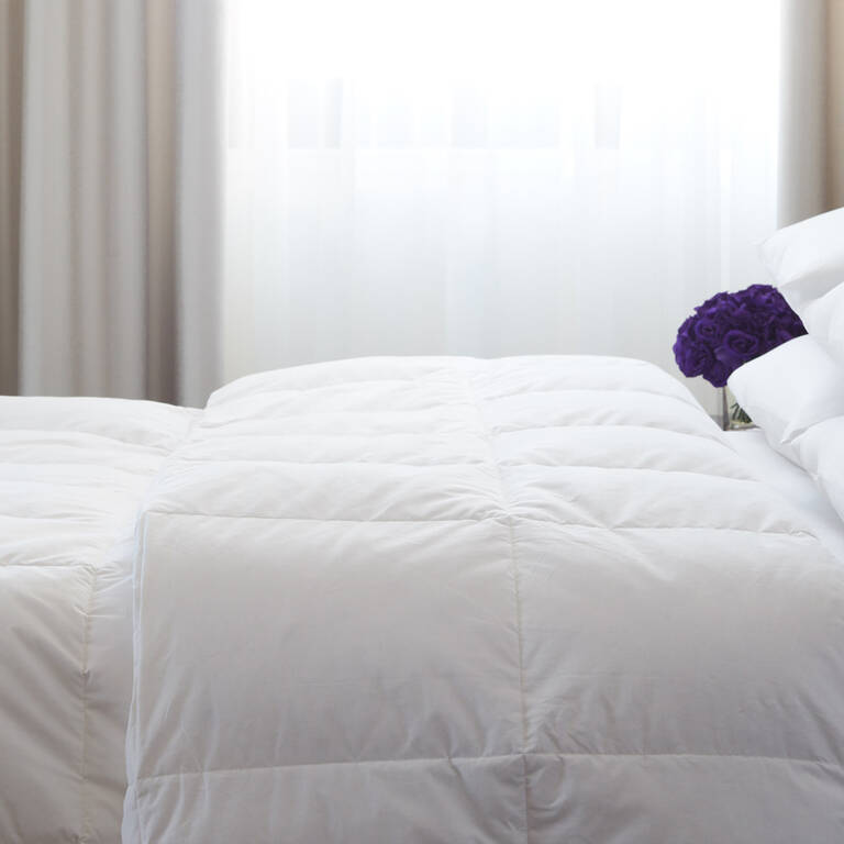 EDITION Hotels duvet on bed