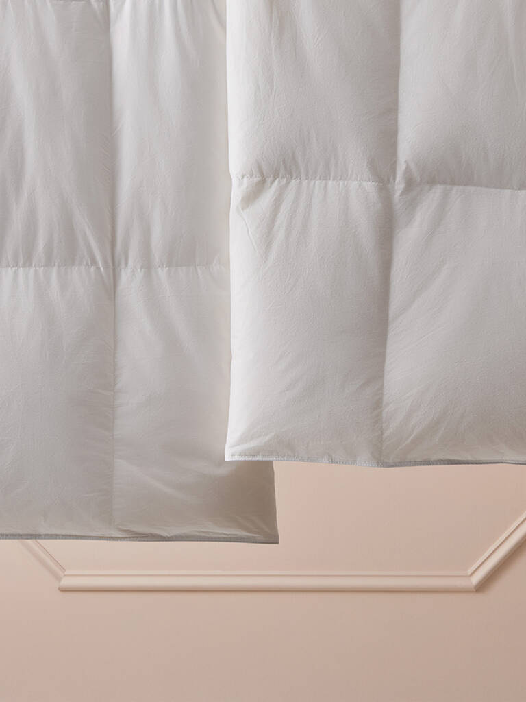 Closeup of Marriott Bonvoy Boutiques white duvet insert and pillow Closeup of Marriott Bonvoy Boutiques white duvet insert and pillow