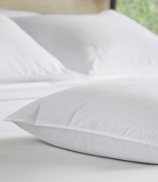 JW Marriott down and feather pillow on bed