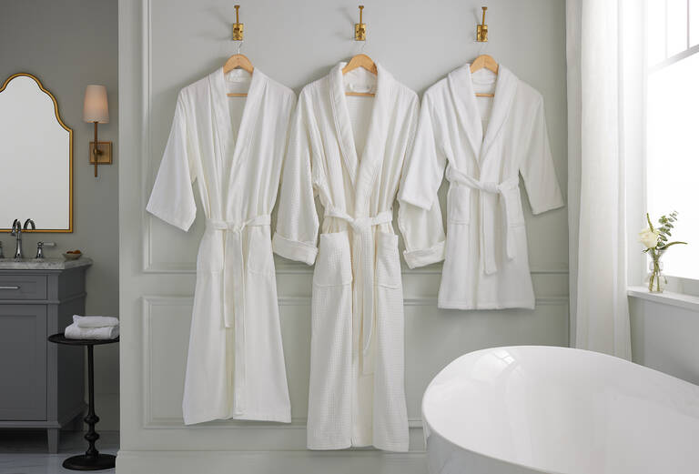 The Ritz-Carlton bath robes hanging in luxury bathroom