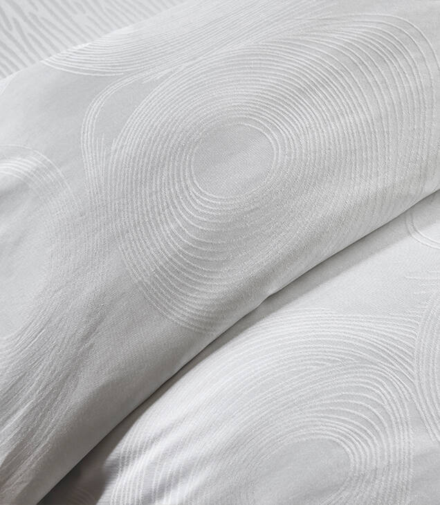 JW Marriott Geo Linen bedding closeup detail of geometric pattern