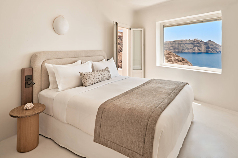 The Luxury Collection bed in hotel room with a view of the sea The Luxury Collection bed in hotel room with a view of the sea
