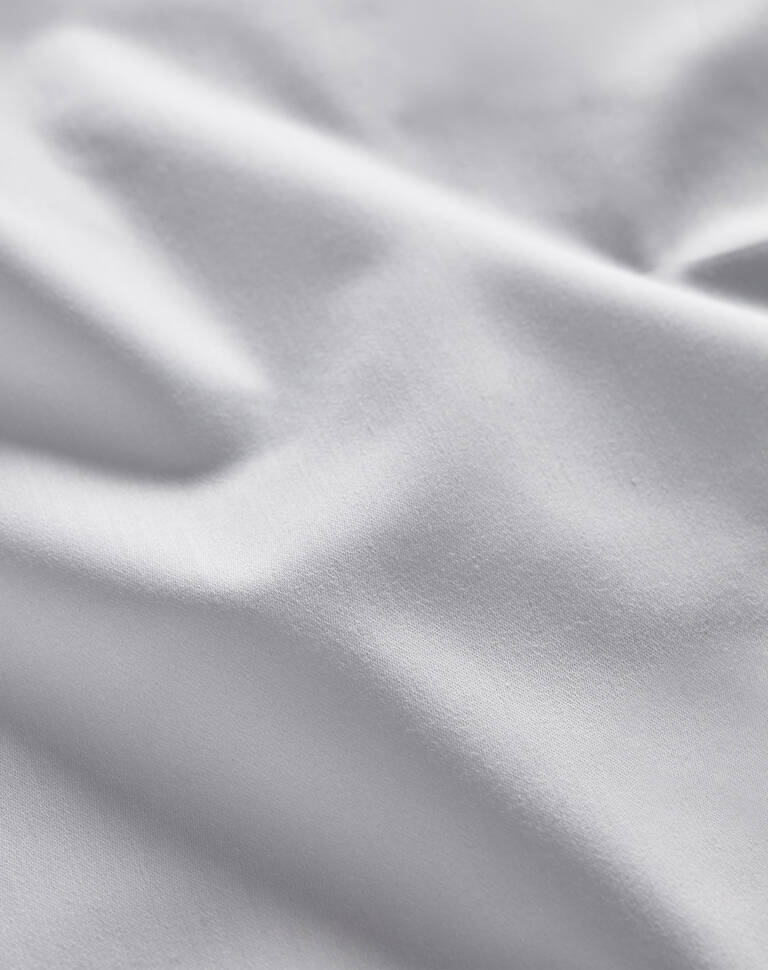 Closeup details of Marriott Bonvoy Boutiques white sateen sheet
