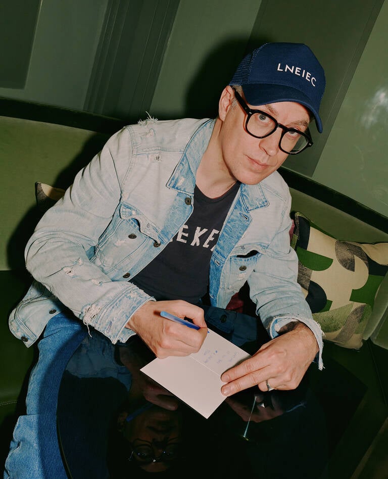Artist Thomas Lelu writing note on W Hotels paper pad Artist Thomas Lelu writing note on W Hotels paper pad