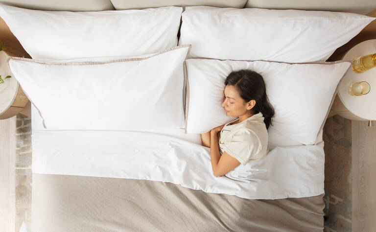 Woman sleeping in Westin Heavenly Bed