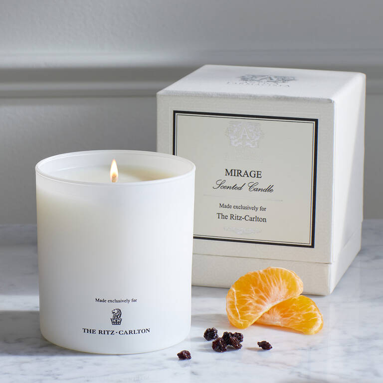 The Ritz-Carlton Mirage Scented Candle with citrusy scent notes