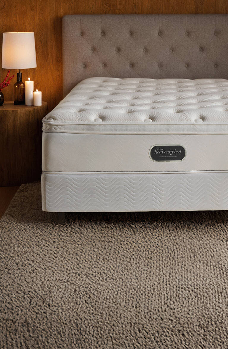 Westin Heavenly Bed mattress in holiday-themed bedroom with a snowy winter view